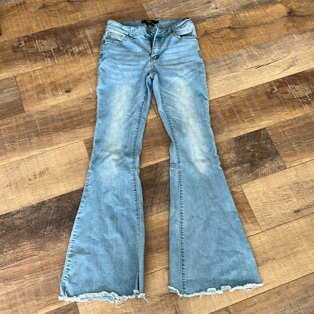 Light wash denim flare jeans or bell bottoms
